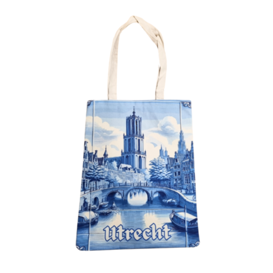 Katoenen canvas draagtas bedrukt met de Domtoren in Delftblauw, ideaal voor dagelijks gebruik of als geschenk.
